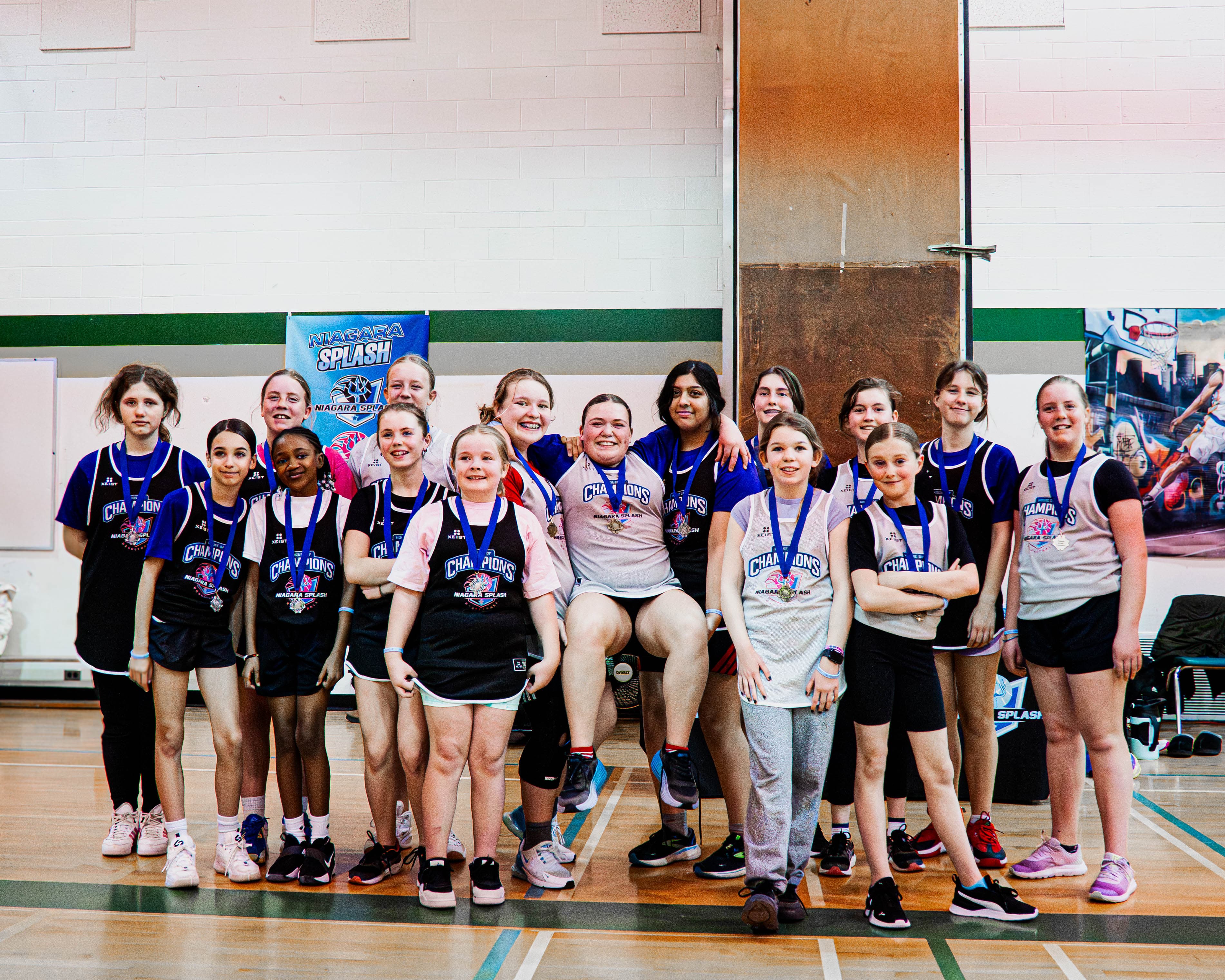 Niagara Splash girls team celebrating with medals