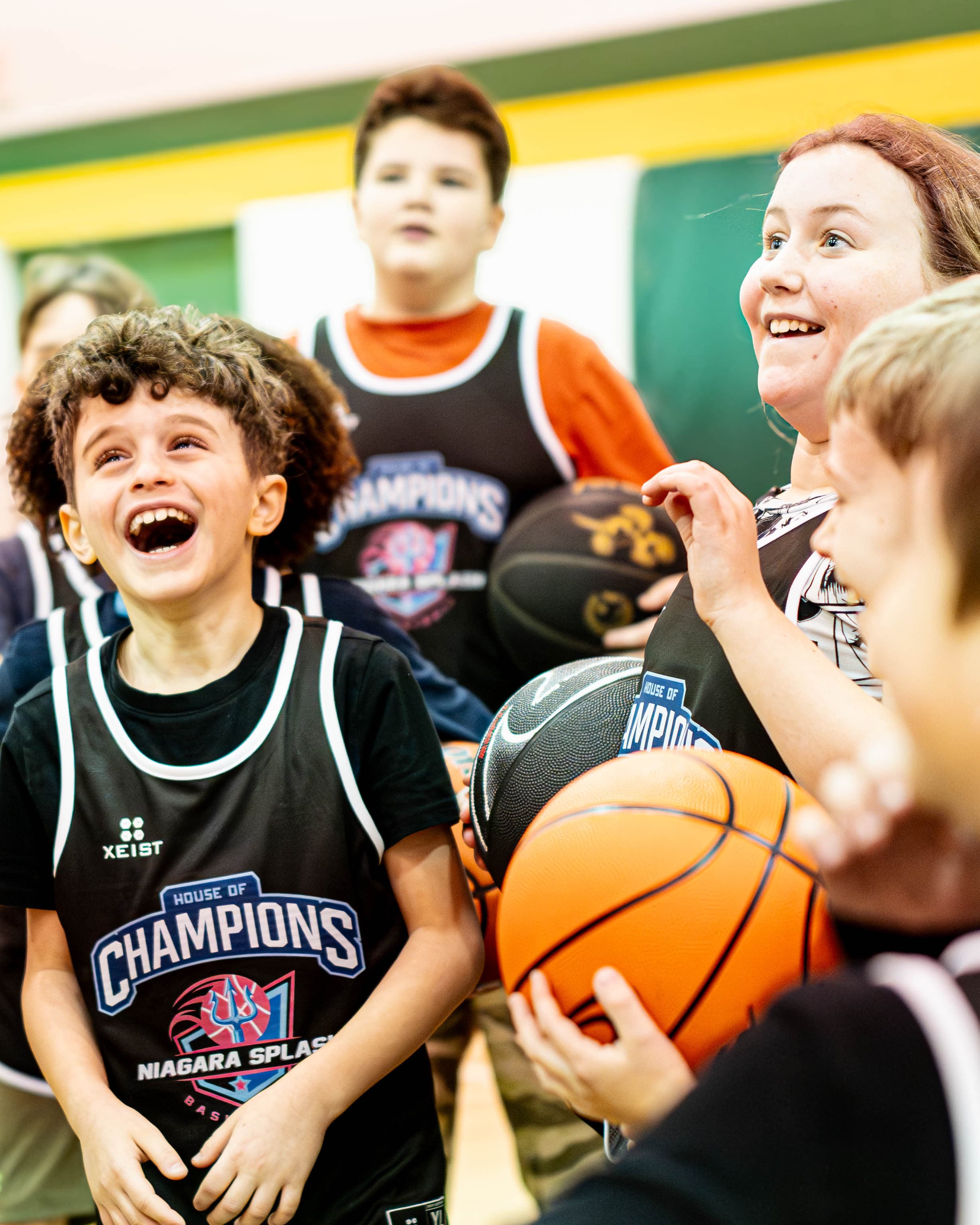 Young athlete laughing at Niagara Splash Minis & Juniors